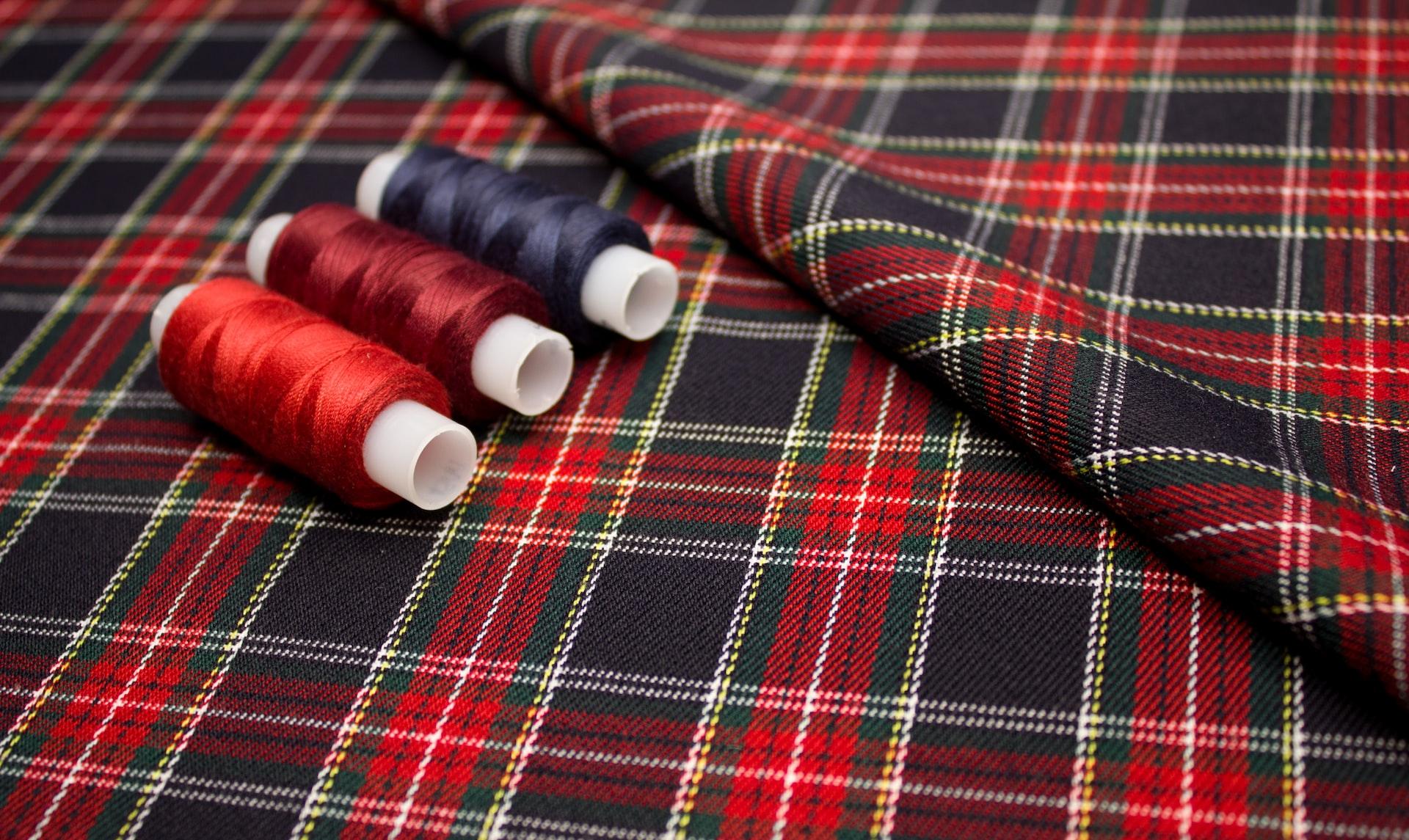 red and white thread on red and white plaid textile